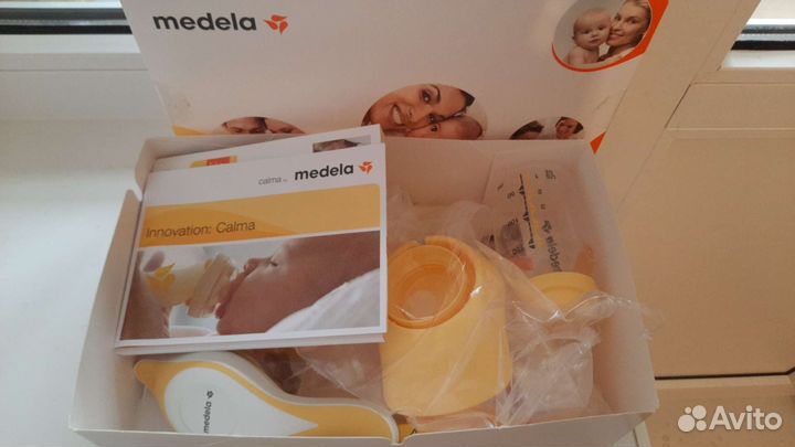 Молокоотсос medela с соской