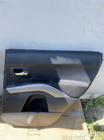 Обшивка двери Outlander xl 2011