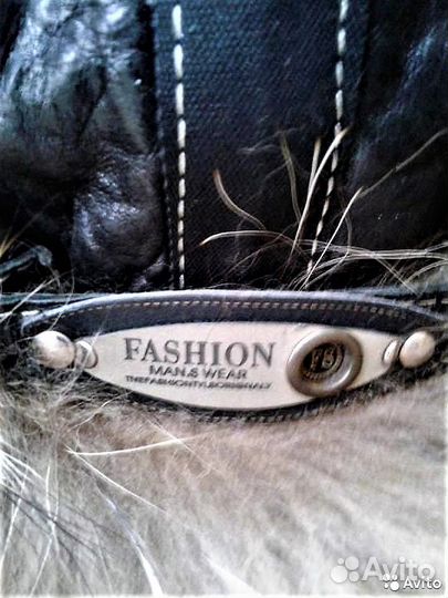 Кожаная ушанка с енотом