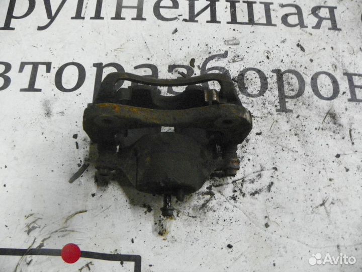 Суппорт тормозной передний левый Kia Sportage