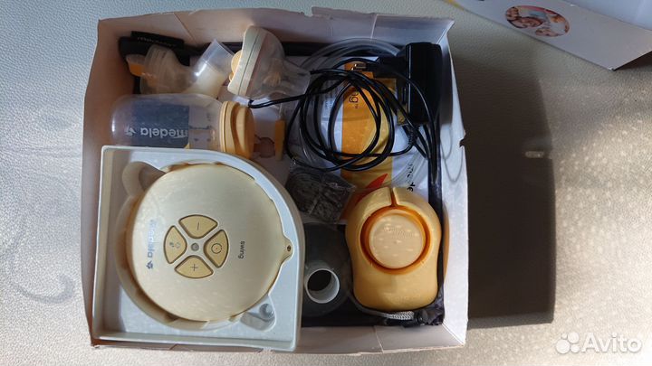 Молокоотсос Medela swing