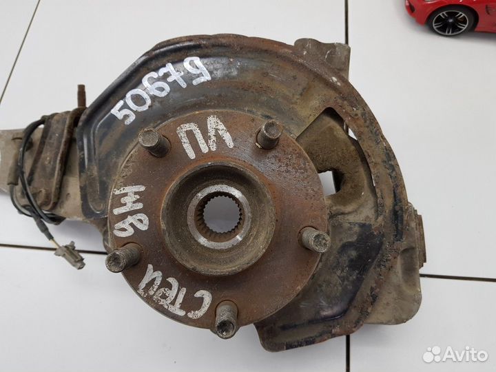 Кулак поворотный передний левый в сборе