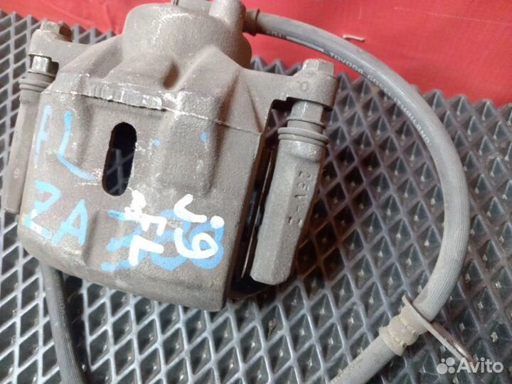 Суппорт передний левый Toyota Probox NCP51V 1NZ-FE