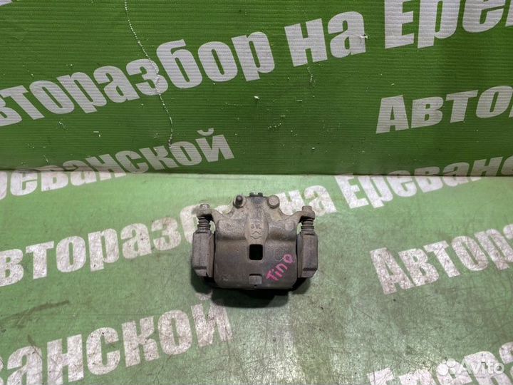 Суппорт тормозной передний правый Nissan Tino