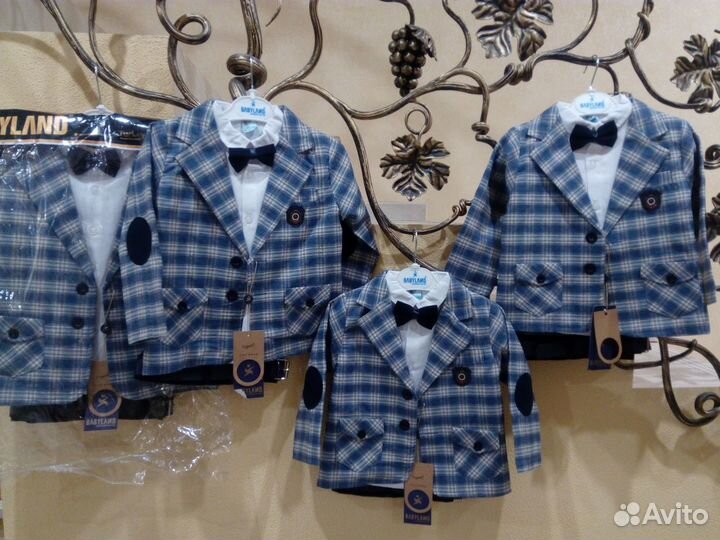 Костюмы новые р.92-110