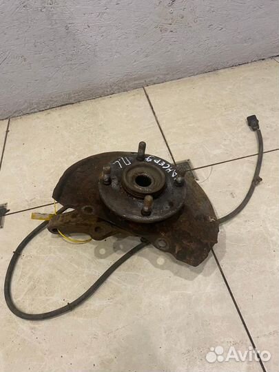 Поворотный кулак передний левый Mitsubishi Lancer