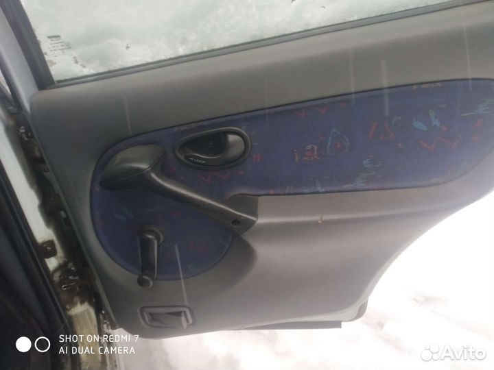 Обшивка двери Fiat Palio