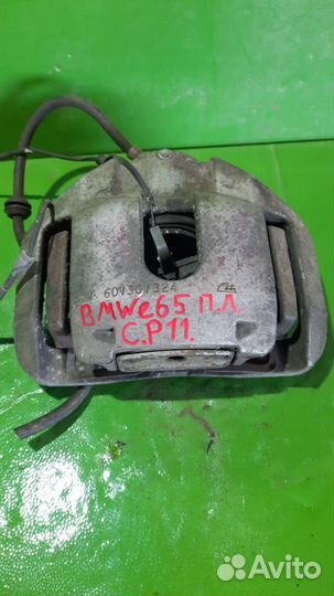 Суппорт тормозной BMW 7-Series слева спереди 34116