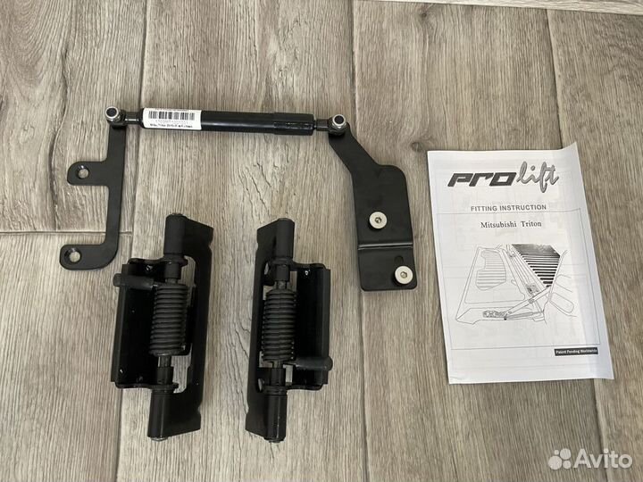 Амортизатор борта Mitsubishi L200