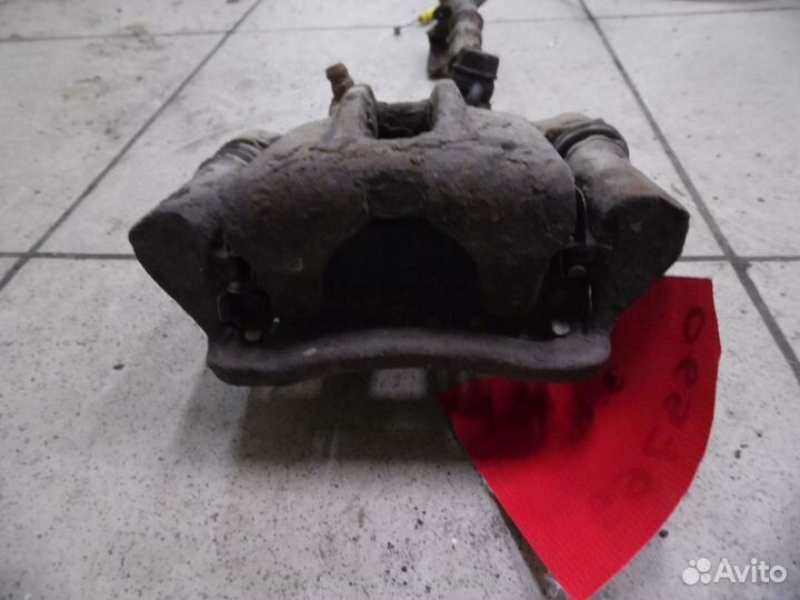 Суппорт тормозной задний правый Toyota Corolla E12