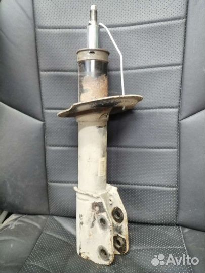 Стойка амортизатора опель антара левая