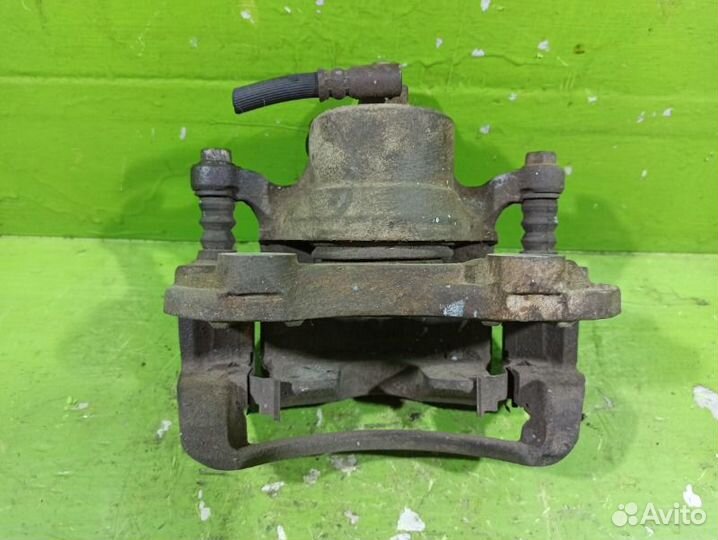 Суппорт тормозной передний левый Nissan Primera