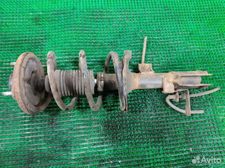 Стойка амортизатора передняя левая Mitsubishi Lan