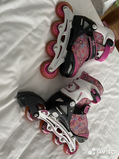 Роликовые коньки