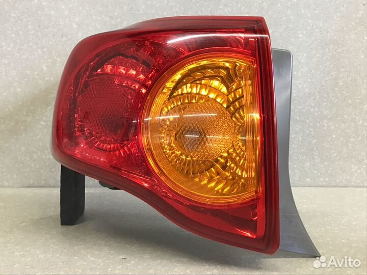 Фонарь задний наружный левый Toyota Corolla E15 20