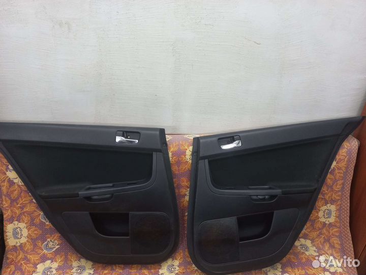 Обшивка дверей митсубиси лансер 10