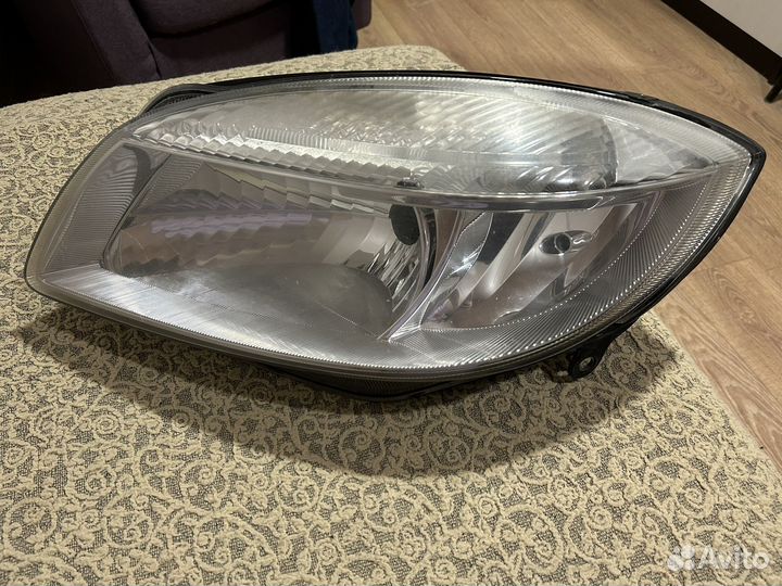 Оригинальная фара(левая) skoda Roomster 2009