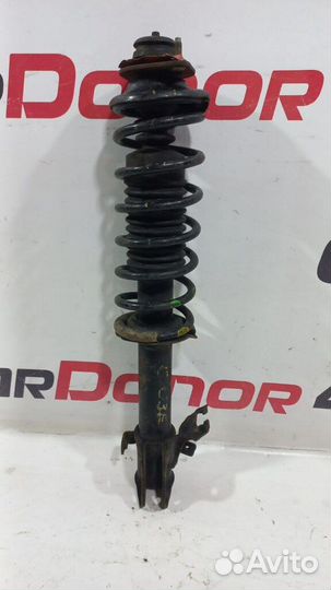 Амортизатор в сборе передний правый б/у для Nissan