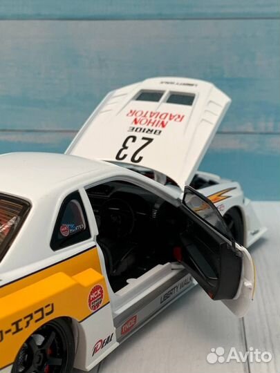 Модель авто Nissan Skyline GT-R R34 lbwk 1:24