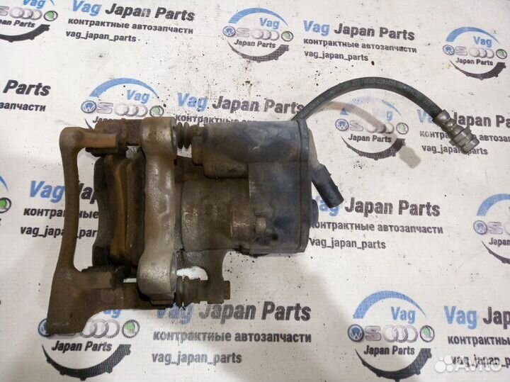 Суппорт тормозной задний правый Volkswagen Tiguan