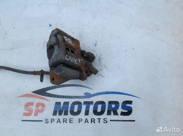 Суппорт задний правый (в сборе со скобой) Honda Ci