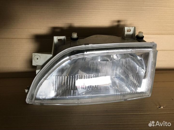 Фара левая Ford Escord оригинал