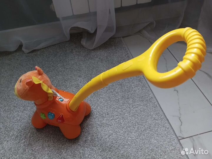 Каталка лошадка музыкальная