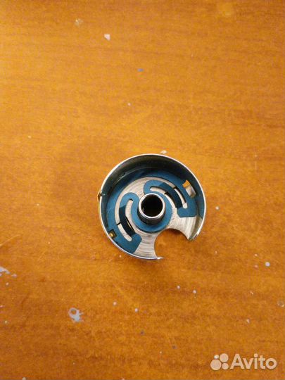 Шпульный колпачок