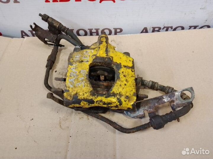 Суппорт тормозной задний левый Dodge Caravan 3.3