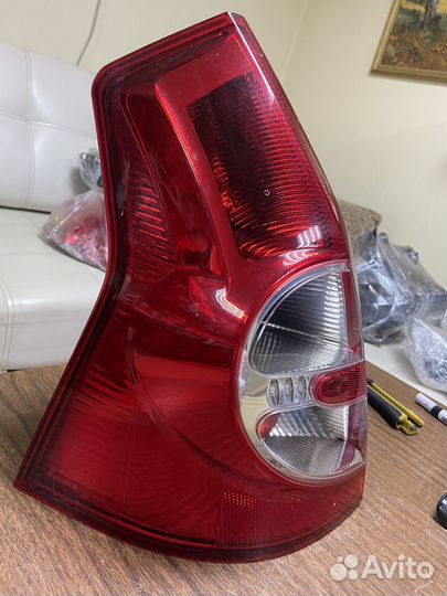 Фонарь левый Renault Sandero 1 09-14г