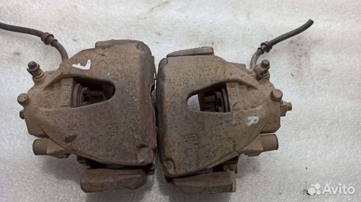 Суппорт тормозной передний Opel Astra H