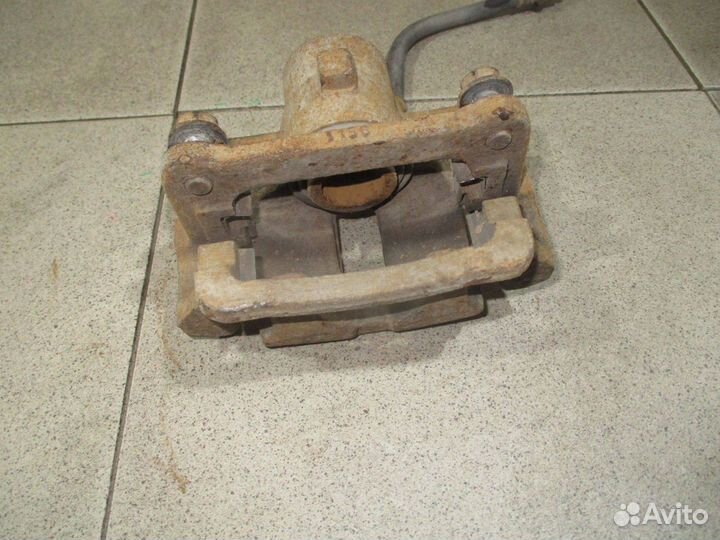 Суппорт задний левый Toyota Corolla (E120) 2000-2