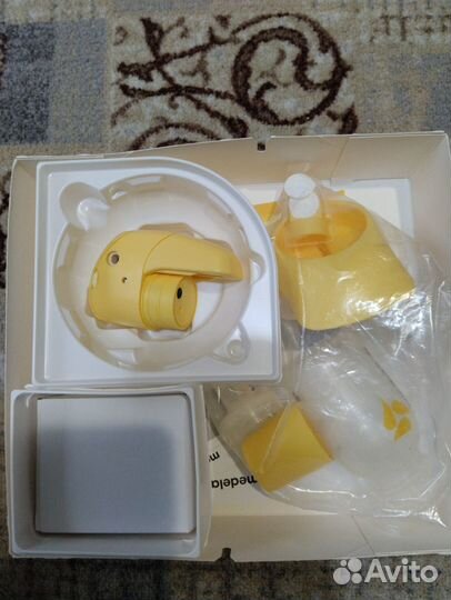 Молокоотсос medela электрический