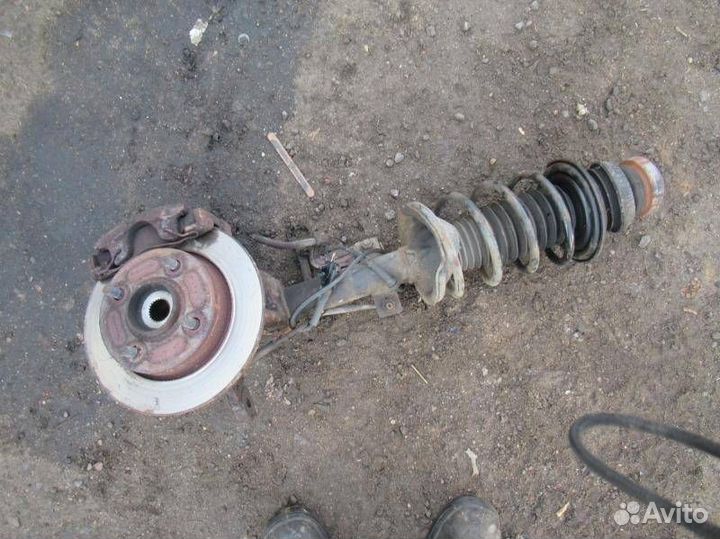 Стойка амортизатора передняя левая Mazda 121 3