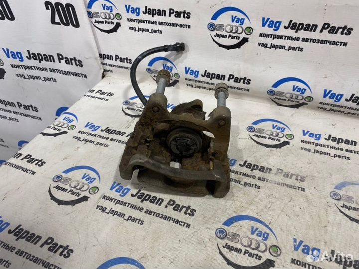 Суппорт тормозной задний левый Volkswagen Tiguan