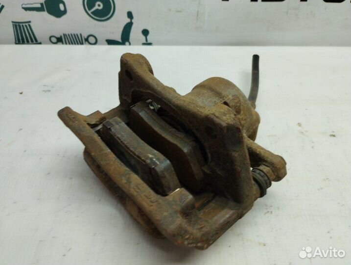 Суппорт тормозной передний левый Renault Duster