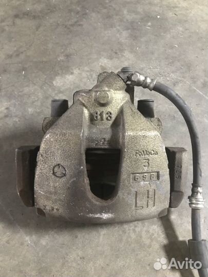 Суппорт тормозной передний левый Mazda 3 BK 2.0