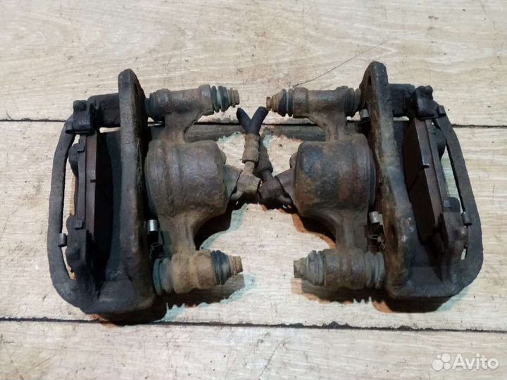 Суппорт тормозной передний Toyota Corolla E110