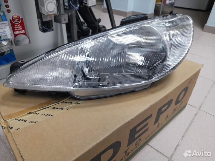 Фара левая Peugeot 206
