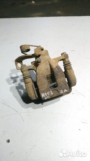 Суппорт тормозной задний левый Kia Rio 3 2013