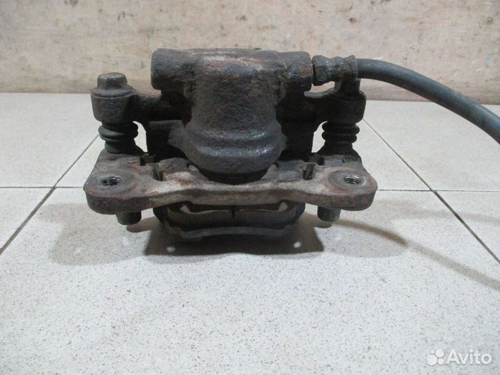 Суппорт задний левый Mitsubishi Lancer 10 (CY)