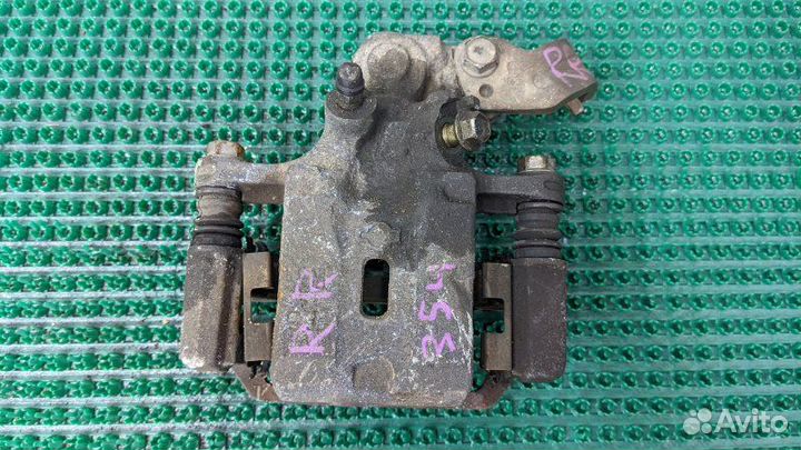 Суппорт тормозной задний правый Nissan Avenir RW11