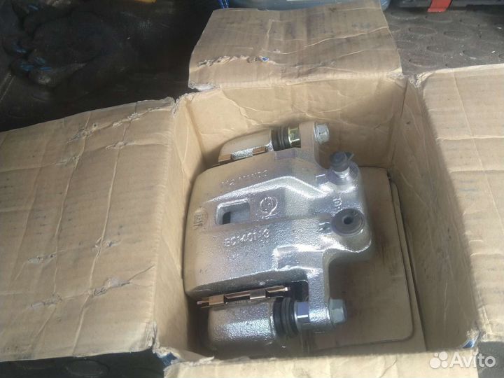 Суппорт Рекстон с 07 г задний новый левый