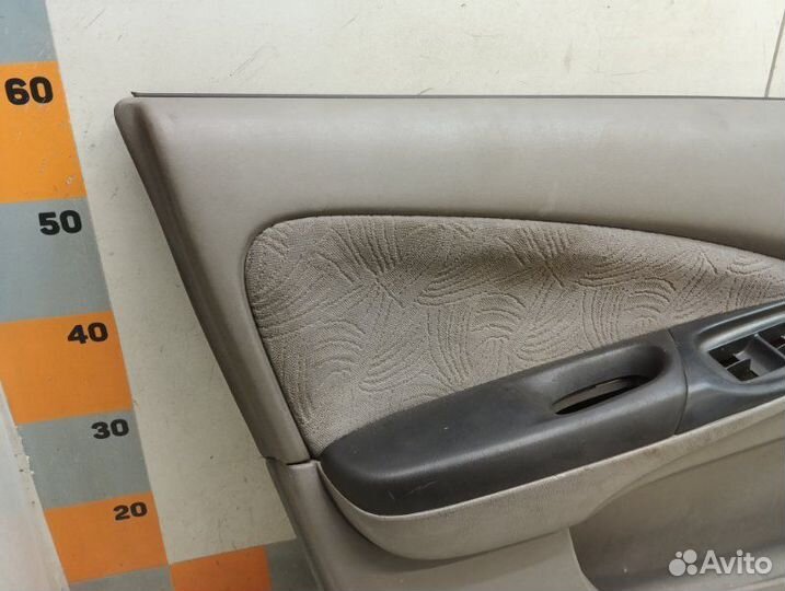Обшивка двери передняя левая Nissan Almera N16 1.8