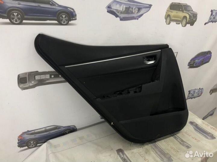 Обшивка двери задняя левая Toyota Corolla E180
