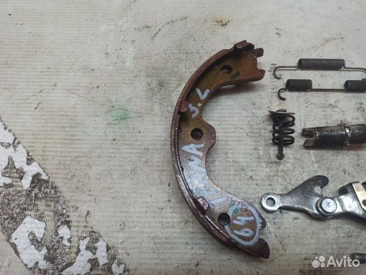 Механизм стояночного тормоза задний левый Nissan