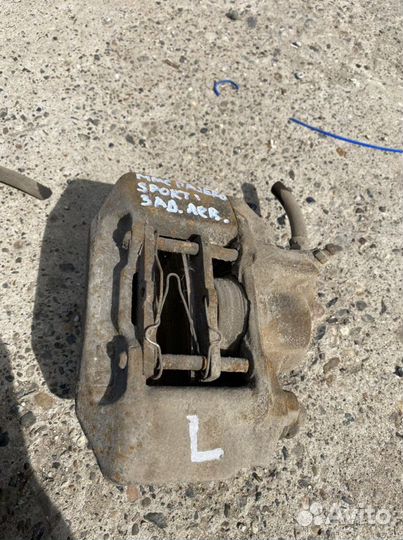 Суппорт тормозной pajero sport 1