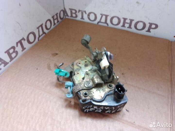 Замок двери передний левый Dodge Caravan