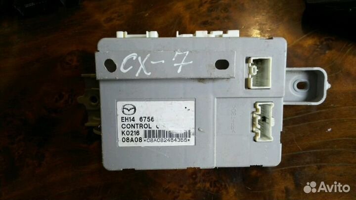 Мазда CX-7 Блок управления EH14 67560