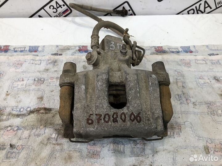 Суппорт задний правый Nissan Primera 12